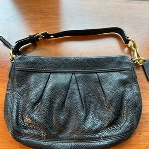 Coach black pebbled leather shoulder bag with purple satin interior